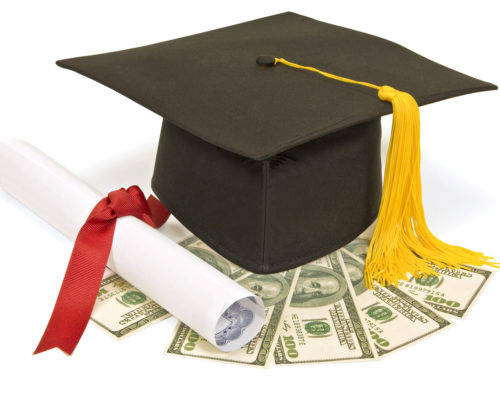 Mortar board, diploma and money.  Ideal concept shot for value of education or cost of education.  Isolated on white.